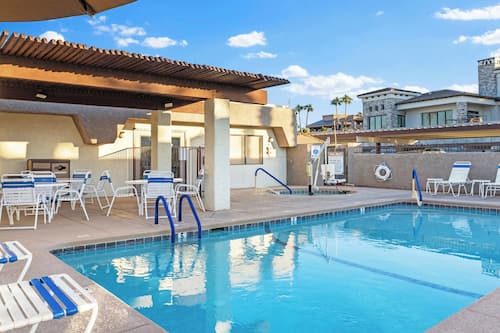 Outdoor pool, open 7:00 AM to 10:00 PM, pool umbrellas, pool loungers
