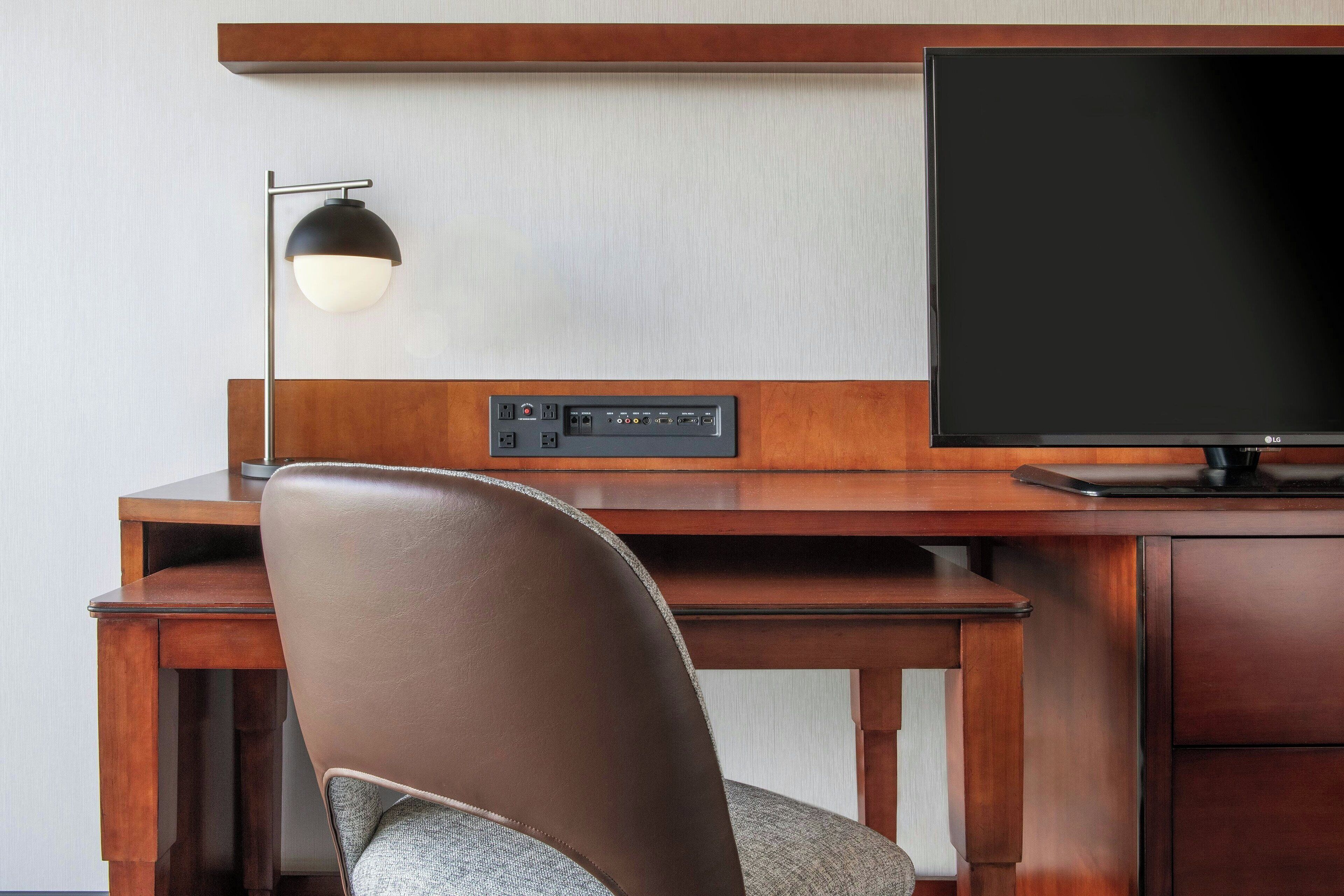 hypo-allergenic bedding, desk, laptop workspace, blackout curtains