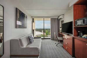 Junior Suite, 1 Bedroom, City View | Living room | 49-inch LED TV with cable channels, Netflix