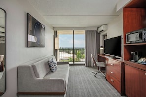 Junior Suite, 1 Bedroom, City View | Living room | 49-inch LED TV with cable channels, Netflix