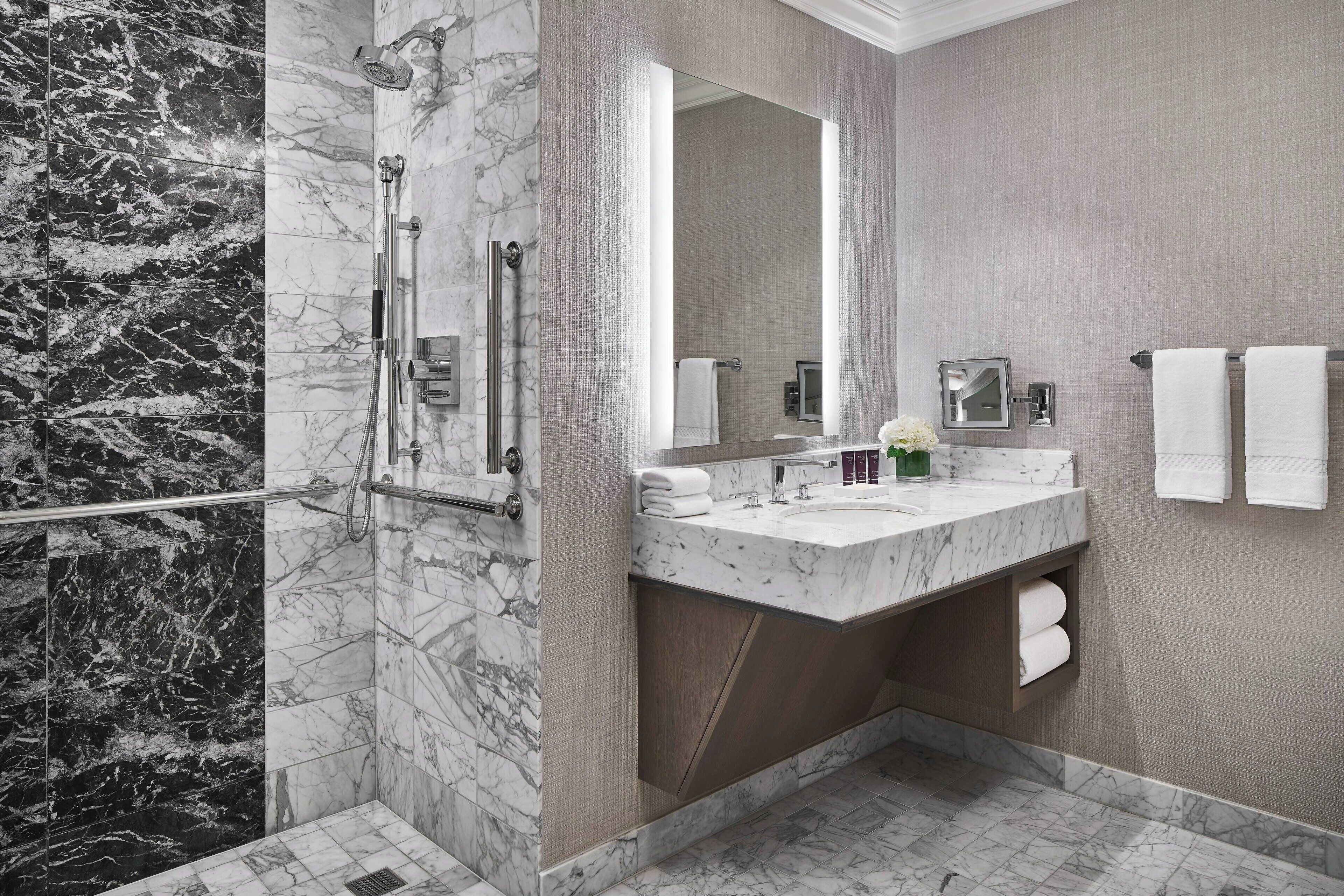 designer toiletries, hair dryer, bathrobes, slippers