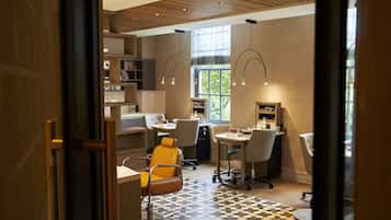 Relax in a clean and inviting space with a central reception area and comfortable seating.