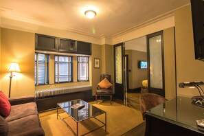 Junior Suite, 1 Queen Bed with Sofa bed | Living room | Flat-screen TV, iPod dock