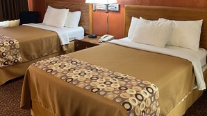 A hotel room with two beds, a nightstand with a lamp, and a telephone. - Executive Inn (Schenectady)
