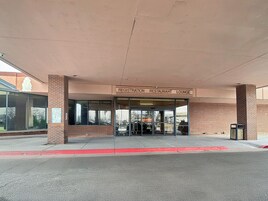 A building with a registration, restaurant, and lounge area.
