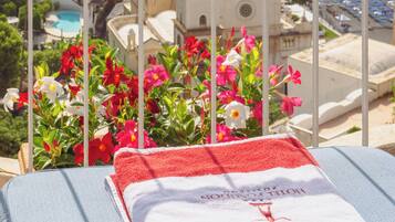 Outdoor pool, open 8:30 AM to 6 PM, pool umbrellas, pool loungers