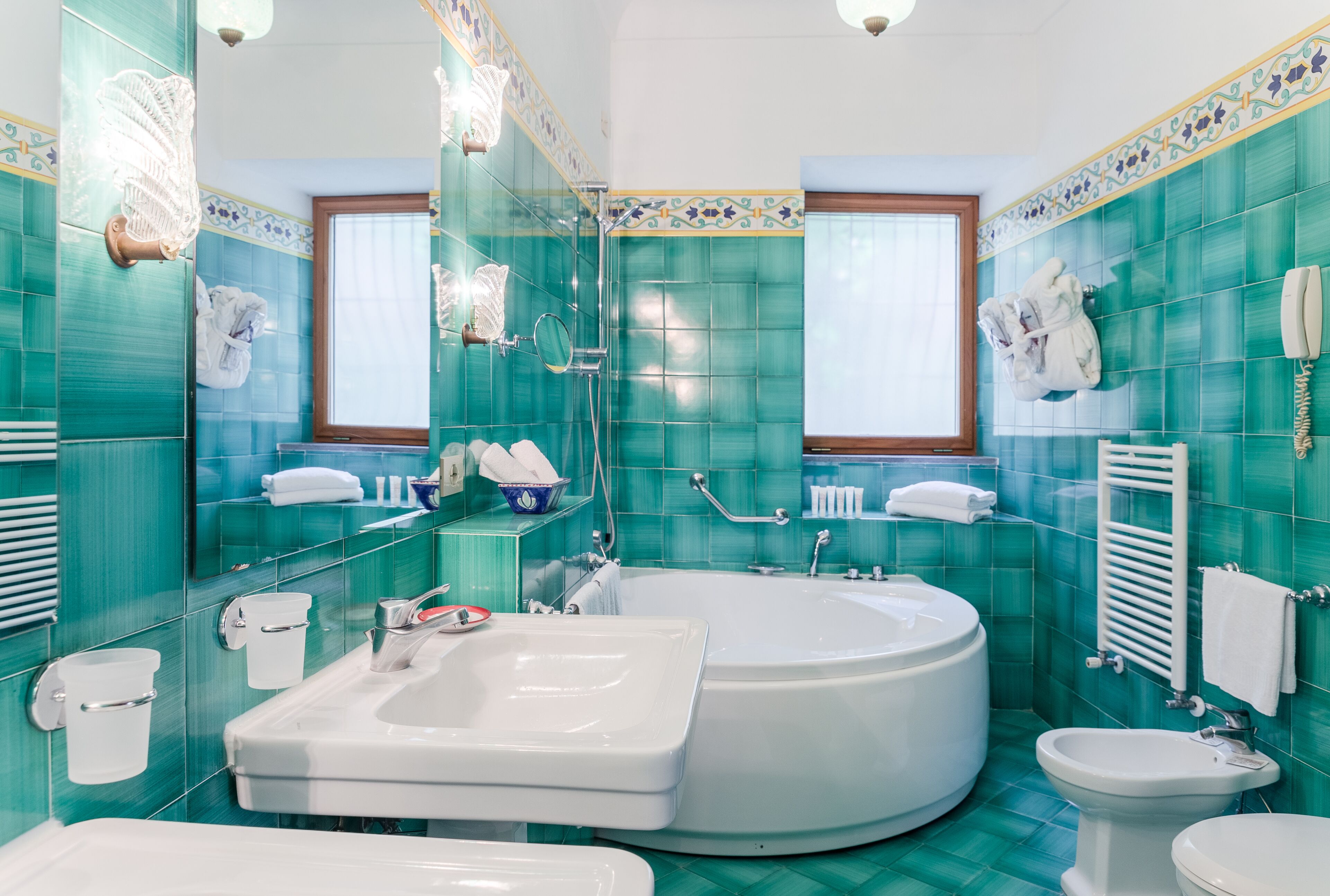 A bathroom with a bathtub, a sink, and a toilet.