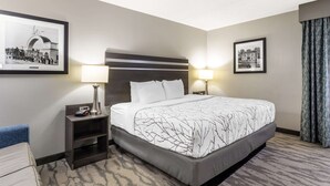 A hotel room with a large bed, two bedside tables with lamps, a headboard, and two framed pictures on the walls. - Best Western Plus Knoxville Cedar Bluff (Knoxville)
