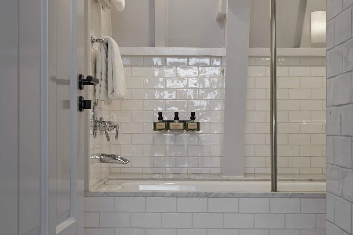 family suite canal view | bathroom | rainfall showerhead, designer toiletries, hair dryer, bathrobes