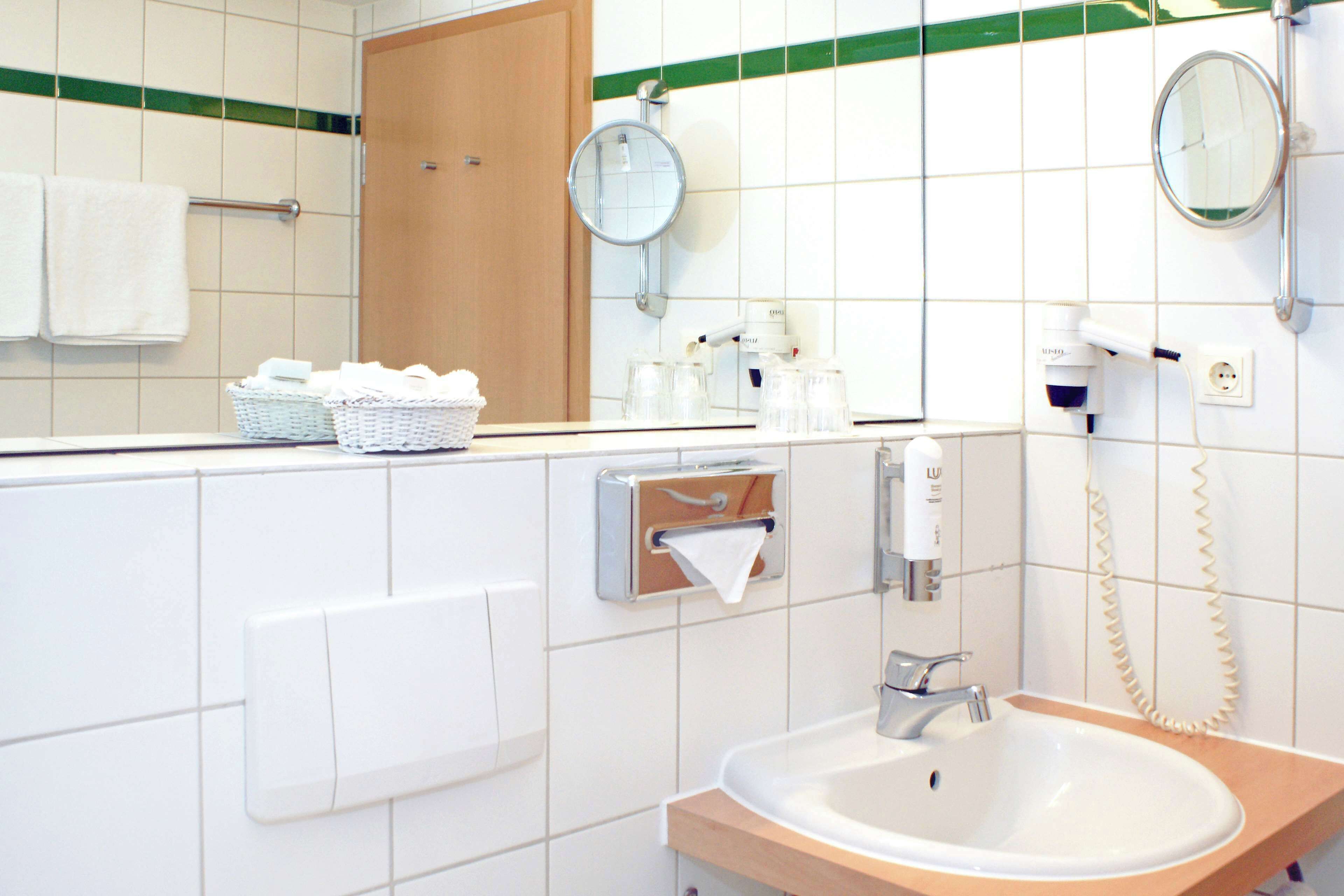 bathtub, free toiletries, hair dryer, towels