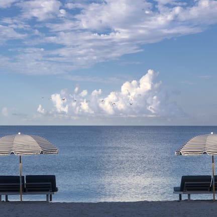 Private beach, white sand, sun loungers, beach umbrellas