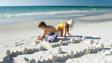Private beach, white sand, sun-loungers, beach umbrellas