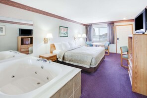 Deluxe Room, 1 King Bed, Hot Tub, Courtyard View | Desk, iron/ironing board, free cribs/infant beds, rollaway beds