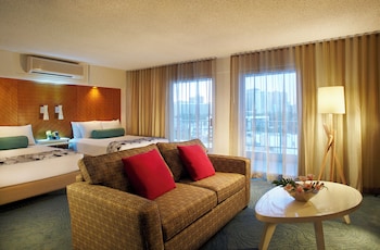 Junior Suite, Multiple Beds, Kitchenette | In-room safe, individually decorated, desk, laptop workspace at Oasis Hotel Waikiki
