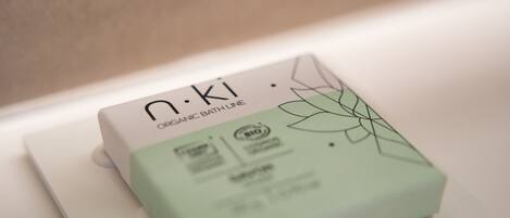 A package labeled "n.ki Organic Bath Line" on a white surface.