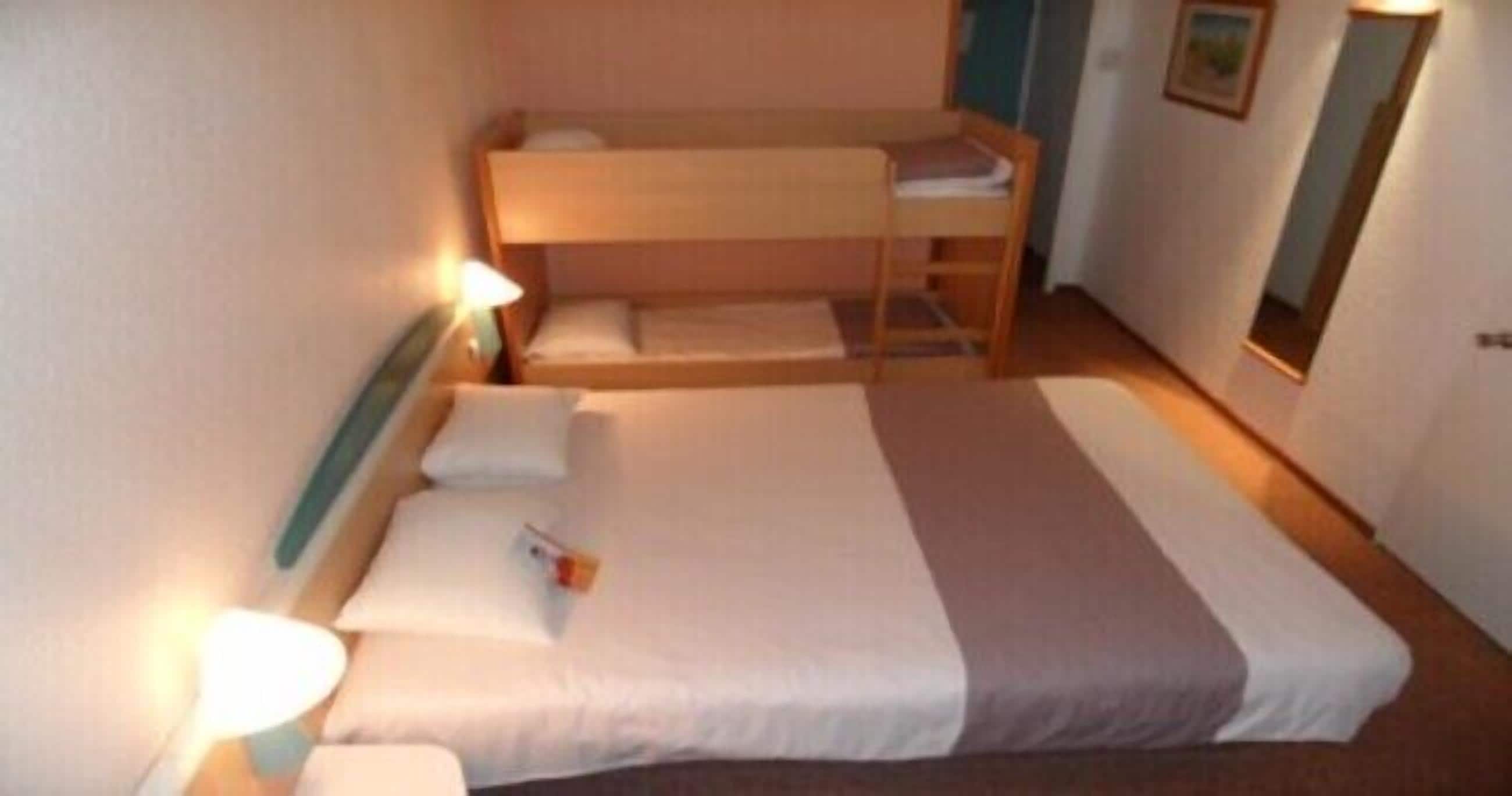 Standard Quadruple Room, Multiple Beds | Premium bedding, desk, blackout drapes, soundproofing