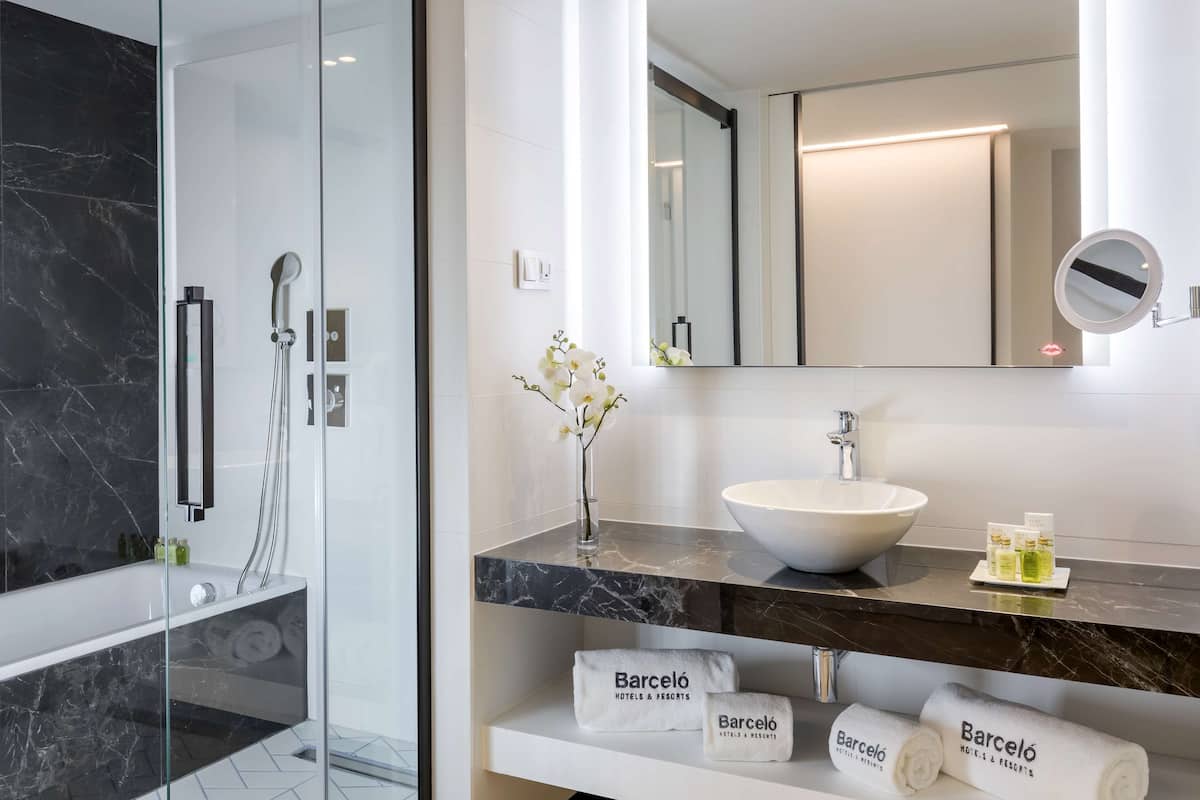 rainfall showerhead, designer toiletries, hair dryer, bathrobes