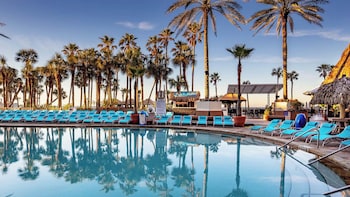 3 outdoor pools, open 8:00 AM to midnight, pool umbrellas, sun loungers at Holiday Inn Resort Panama City Beach by IHG