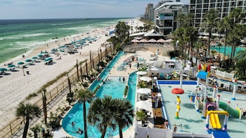 3 outdoor pools, open 8:00 AM to midnight, pool umbrellas, sun loungers at Holiday Inn Resort Panama City Beach, an IHG Hotel