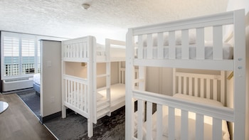 Standard Room, Multiple Beds, Oceanfront | Premium bedding, in-room safe, laptop workspace, iron/ironing board at Holiday Inn Resort Panama City Beach, an IHG Hotel