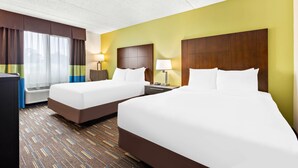 A hotel room with two beds, a desk, a lamp, and a window with curtains. - Comfort Inn Chula Vista San Diego South (Chula Vista)