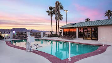 Seasonal outdoor pool, open 9:00 AM to 10:00 PM, pool umbrellas
