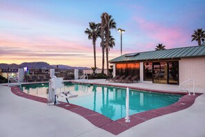 Seasonal outdoor pool, open 9:00 AM to 10:00 PM, pool umbrellas