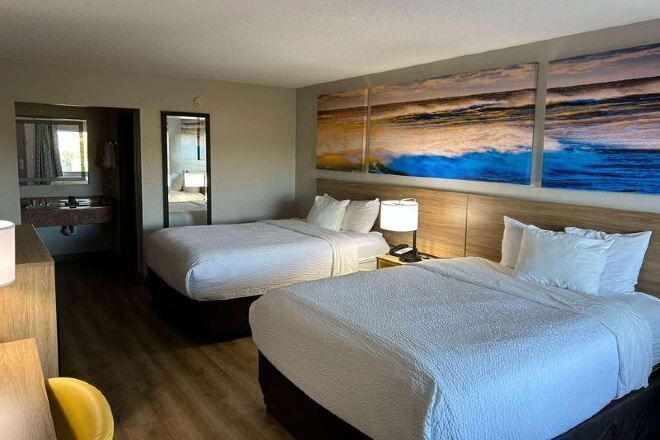 Premium bedding, desk, laptop workspace, iron/ironing board