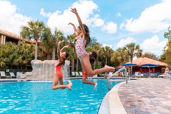 2 outdoor pools, open 6:00 AM to 10:00 PM, cabanas (surcharge) at DoubleTree by Hilton Orlando Theme Park Resort