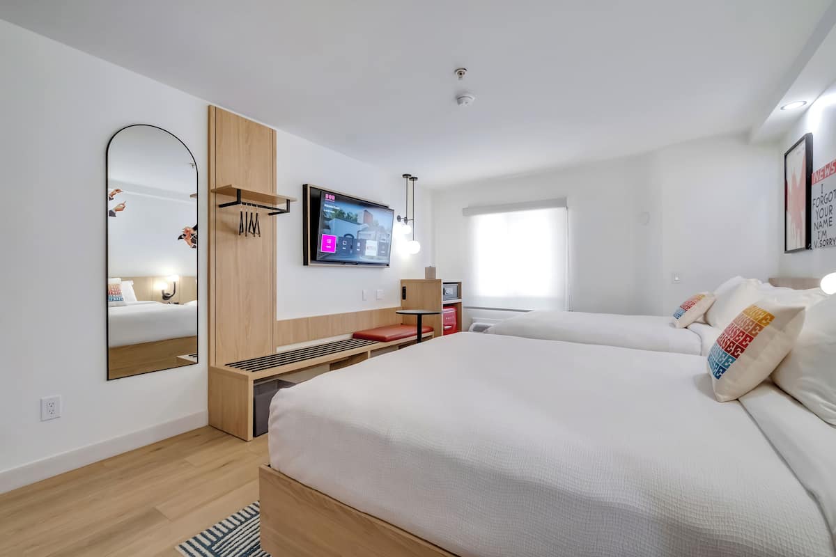 standard room, 2 queen beds | in-room safe, desk, laptop workspace, blackout curtains