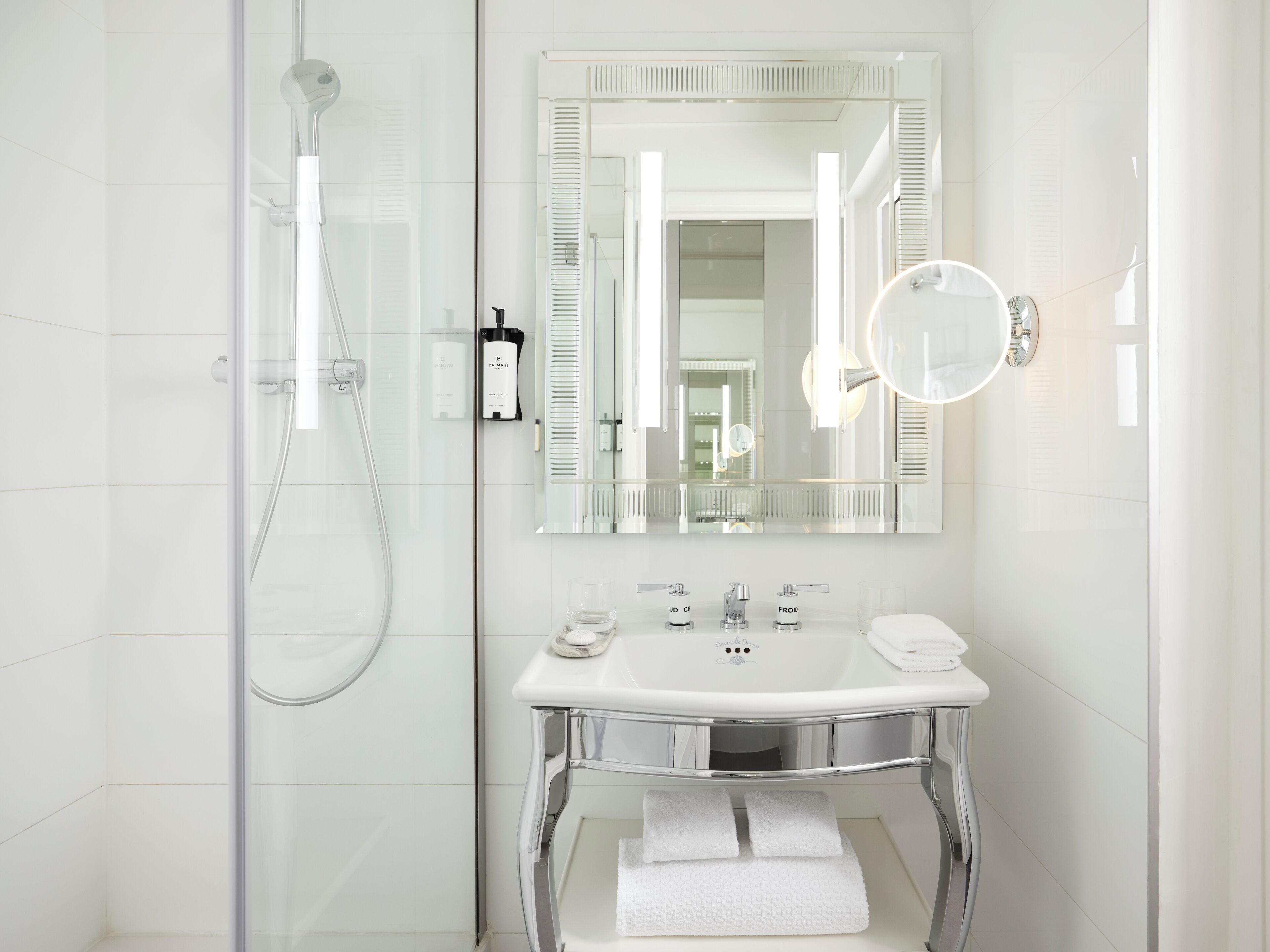 designer toiletries, hair dryer, bathrobes, slippers