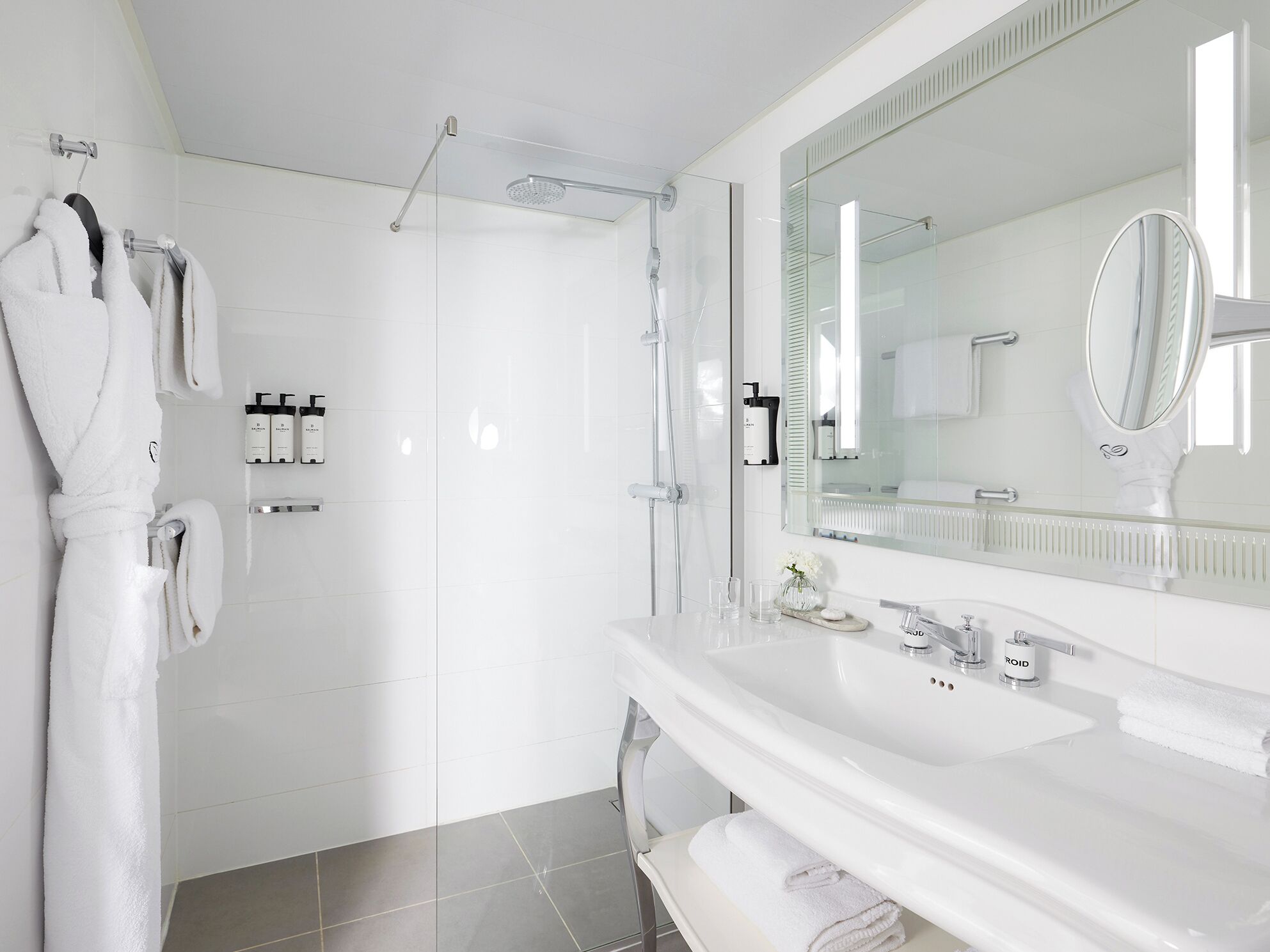 designer toiletries, hair dryer, bathrobes, slippers