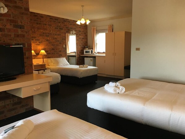 Family Room (1 Queen and 3 Single Beds) | 1 bedroom, desk, blackout drapes, iron/ironing board