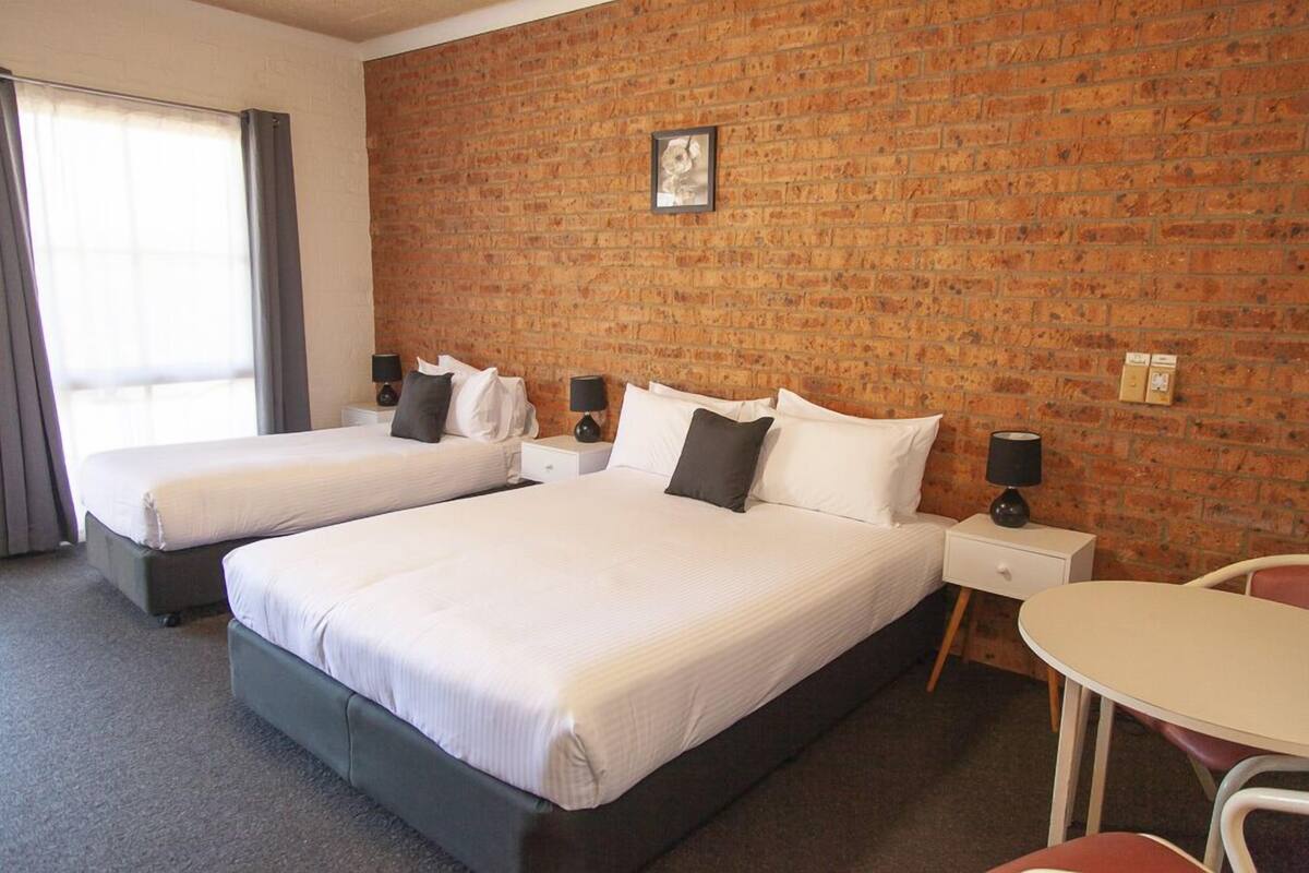 Twin Room | Desk, blackout drapes, iron/ironing board, WiFi (free)