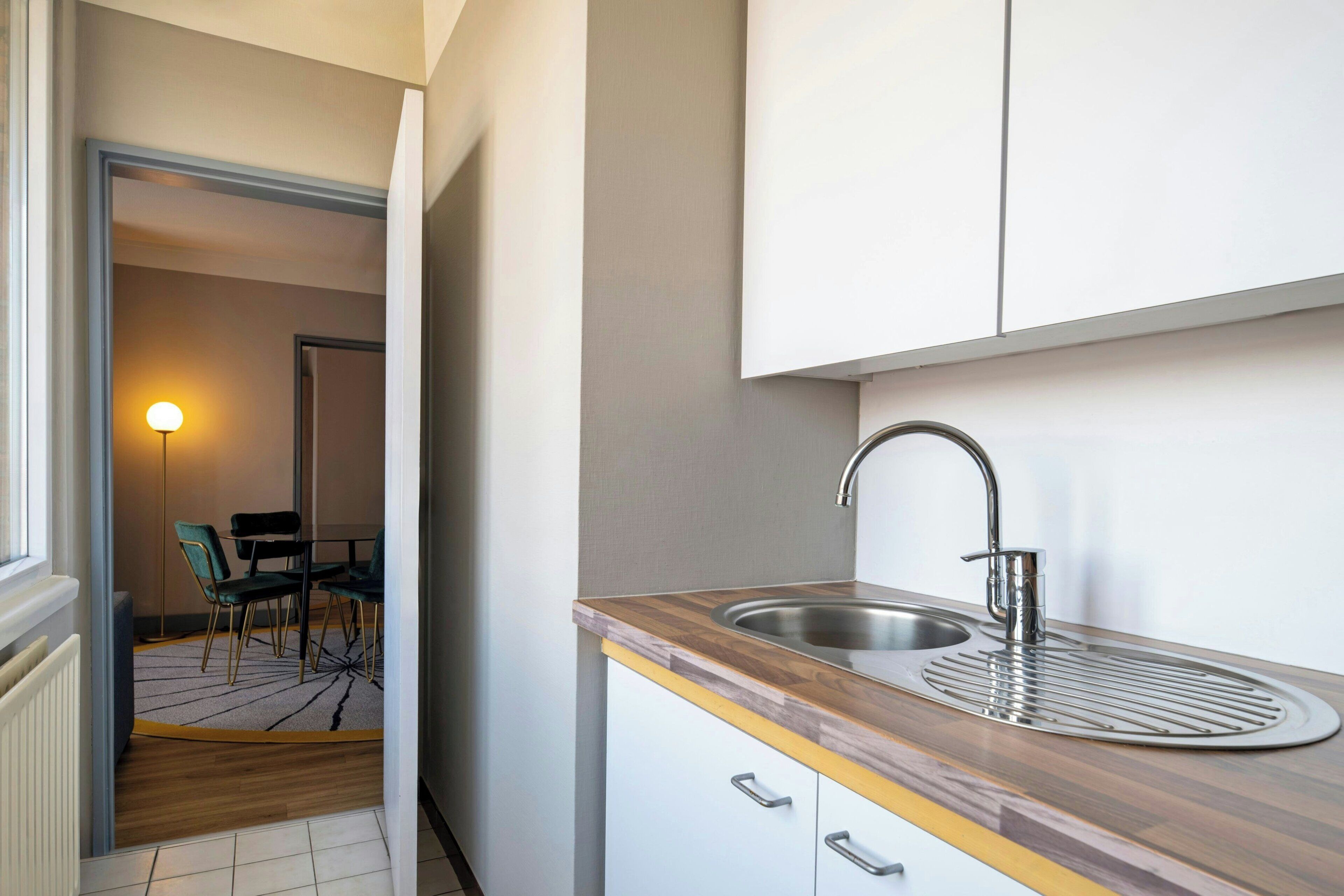 Apartment, 1 King Bed | Private kitchen | Mini-fridge, electric kettle