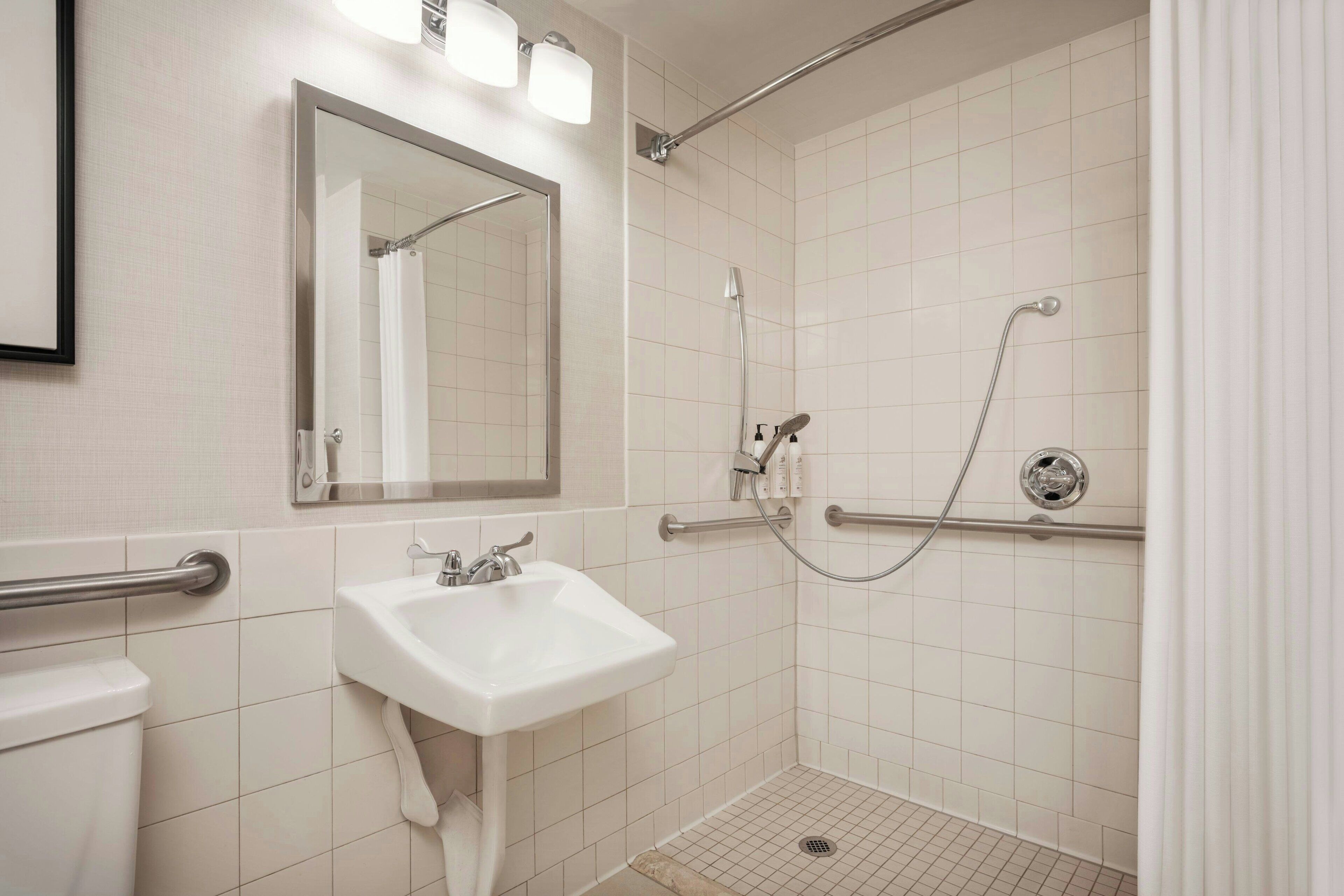 room, 1 king bed with sofa bed, non smoking | bathroom | combined shower/bathtub, free toiletries, hair dryer, towels