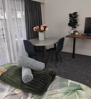 Down comforters, desk, blackout drapes, iron/ironing board