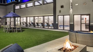 A hotel exterior with a fire pit and outdoor seating area. - Doubletree by Hilton Monroe Township Cranbury (Monroe Township)