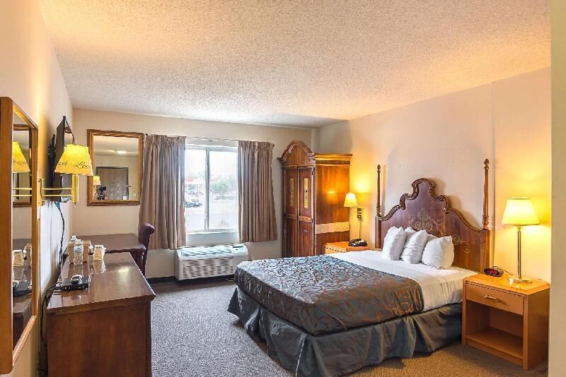 Desk, blackout drapes, iron/ironing board, rollaway beds