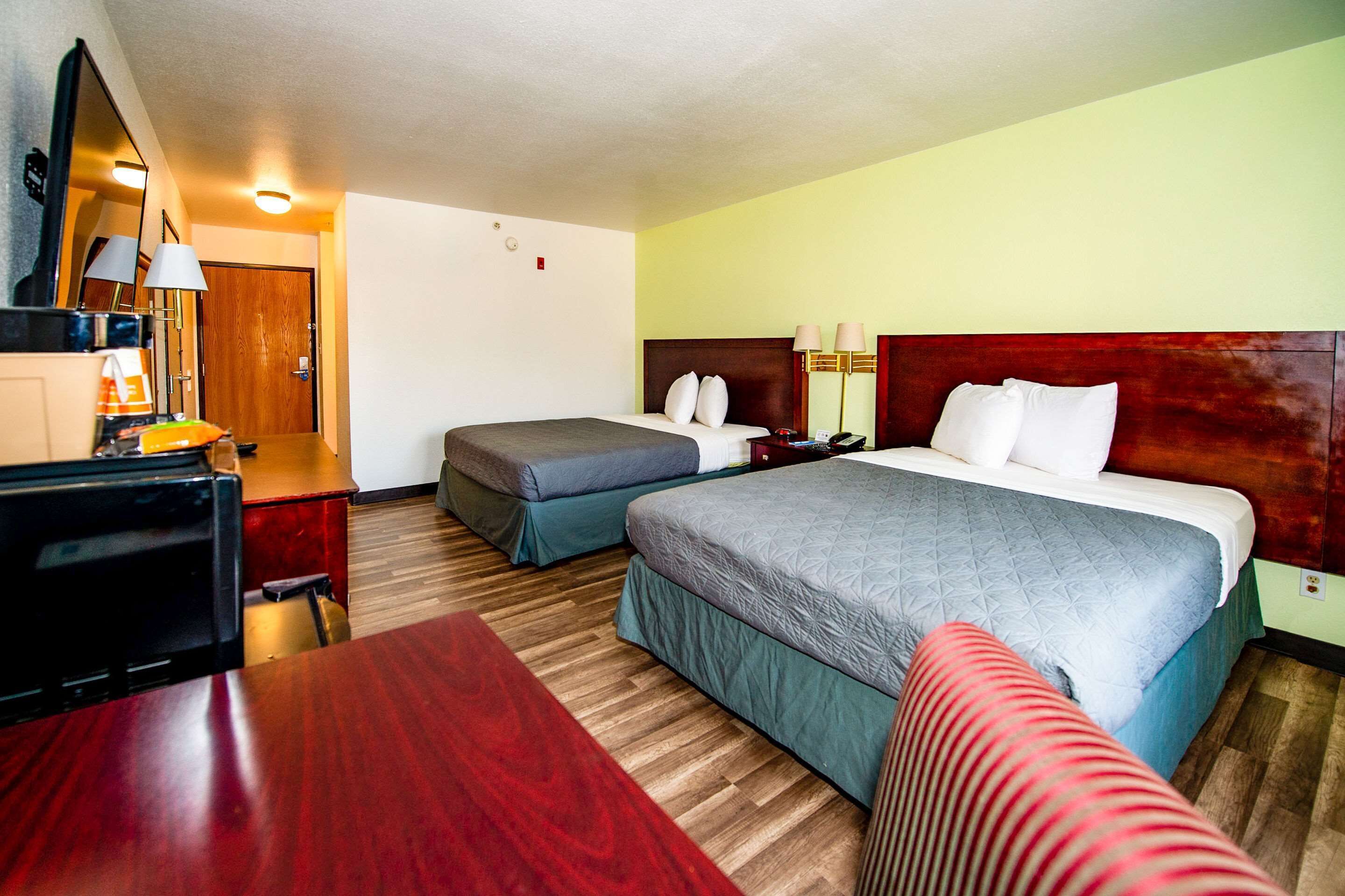 desk, blackout curtains, iron/ironing board, rollaway beds