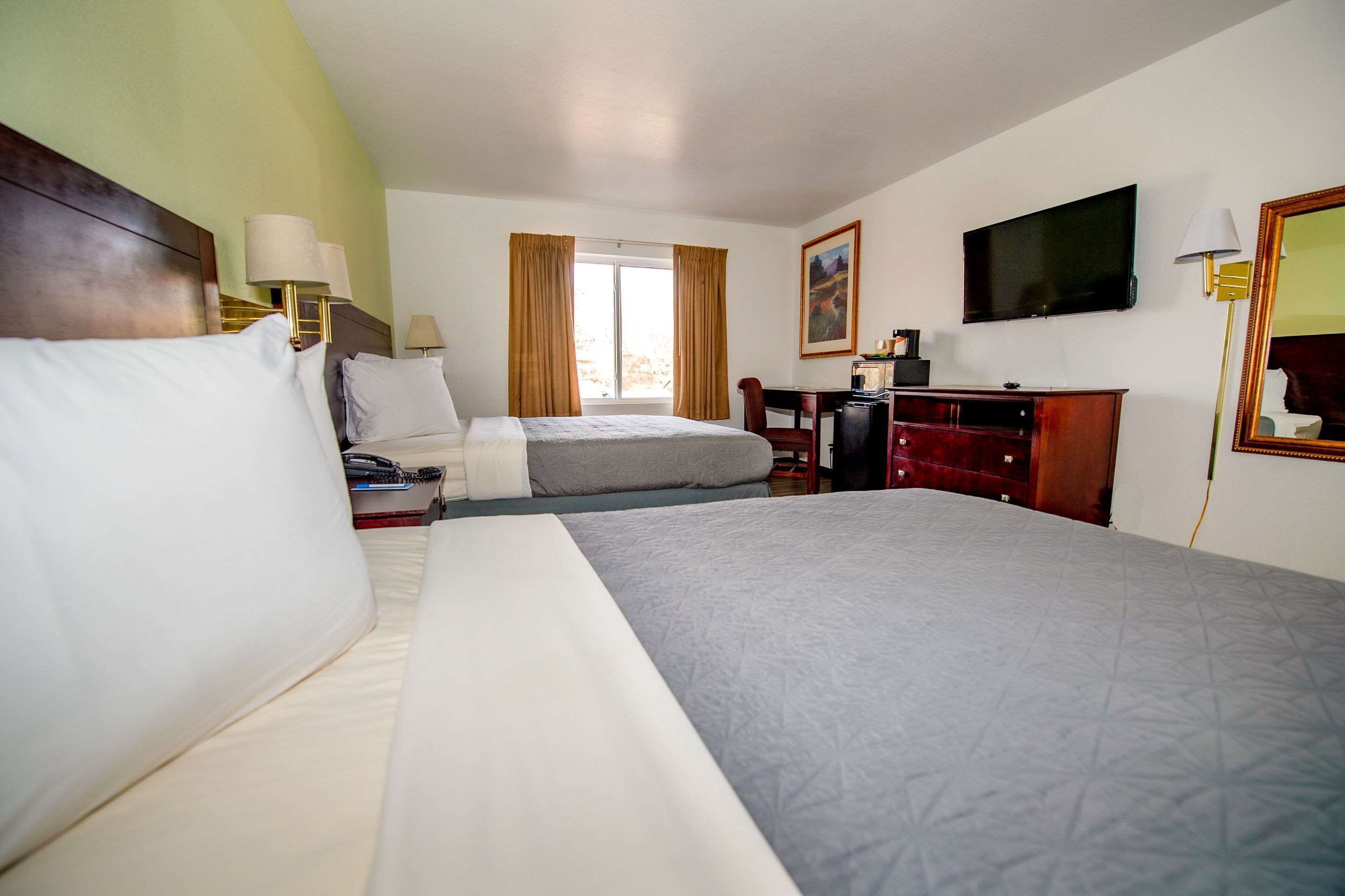 desk, blackout curtains, iron/ironing board, rollaway beds