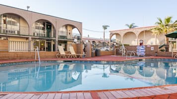Outdoor pool, a heated pool, sun loungers