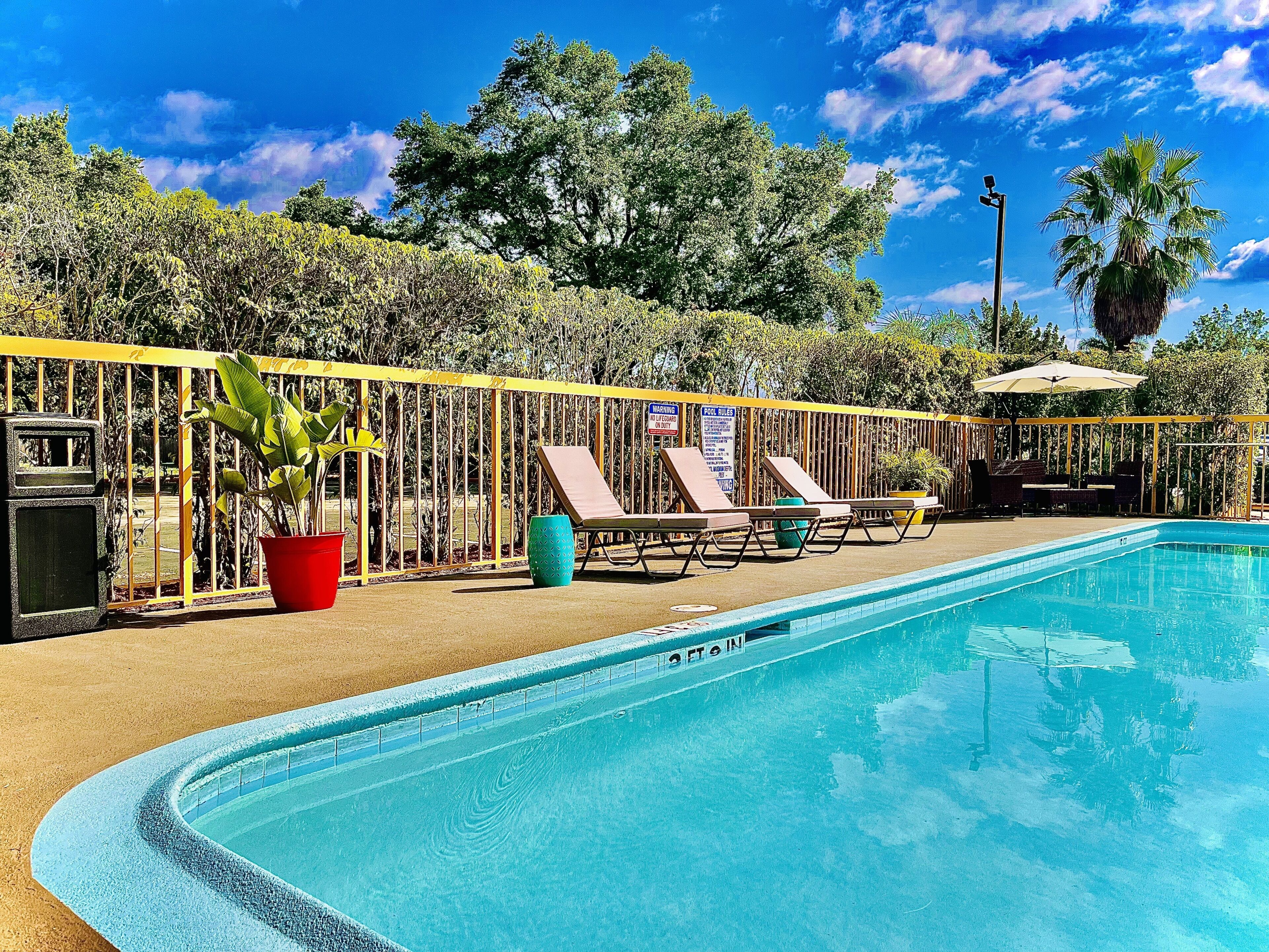 outdoor pool, open 8:00 am to 8:00 pm, pool umbrellas, pool loungers