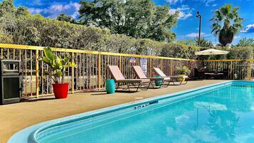 Outdoor pool, open 8:00 AM to 8:00 PM, pool umbrellas, pool loungers