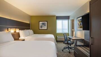 Ropa de cama de alta calidad y caja de seguridad en la habitación