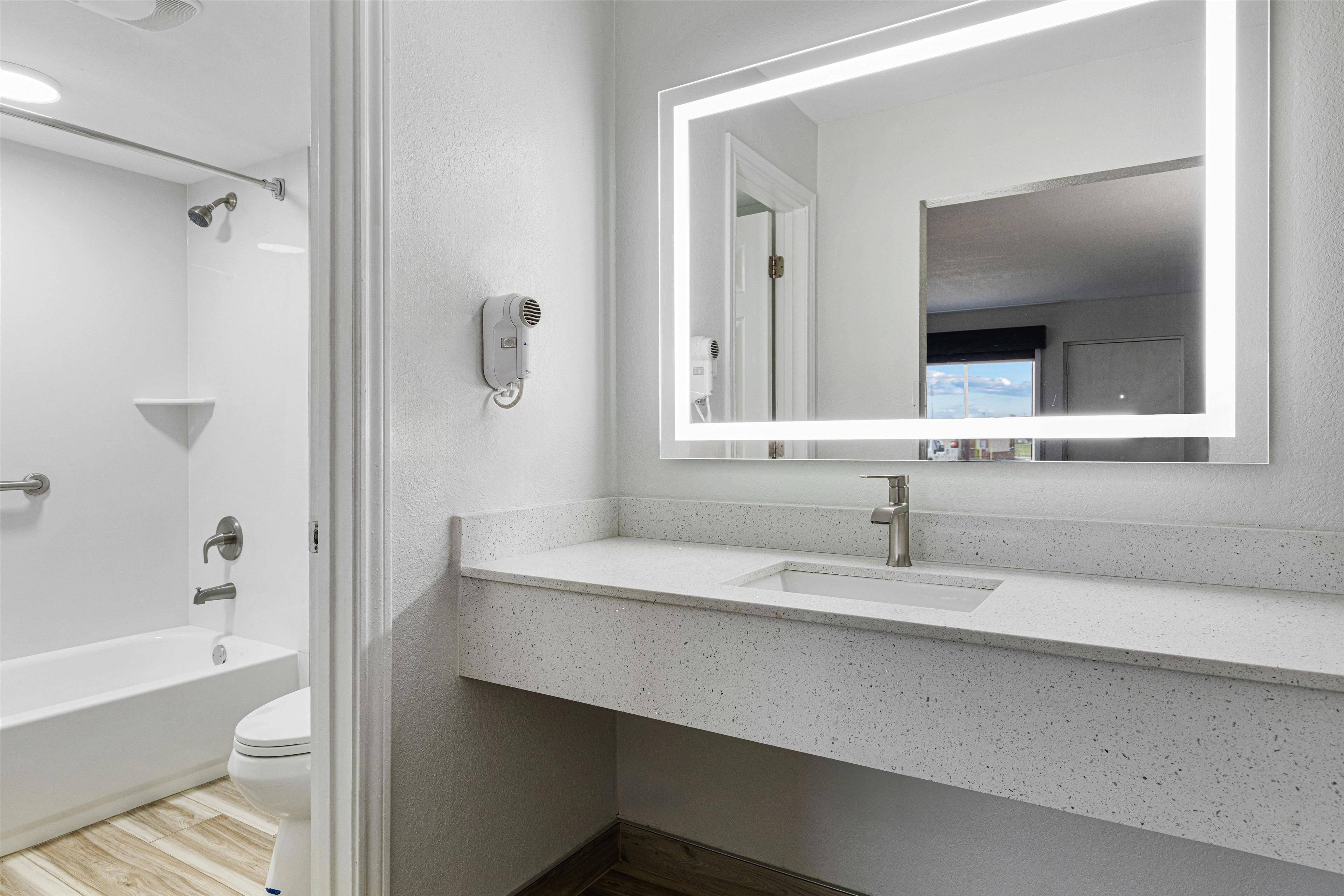 standard room, 2 queen beds, non smoking, refrigerator & microwave | bathroom | shower, free toiletries, hair dryer, towels