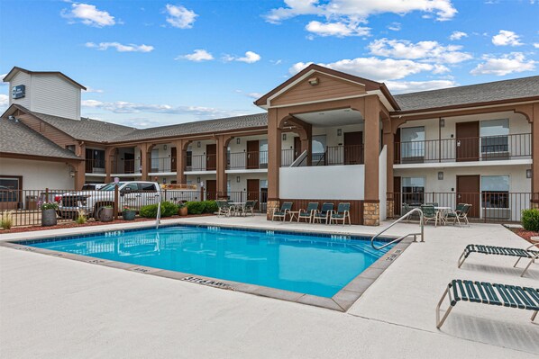 Seasonal outdoor pool, pool loungers