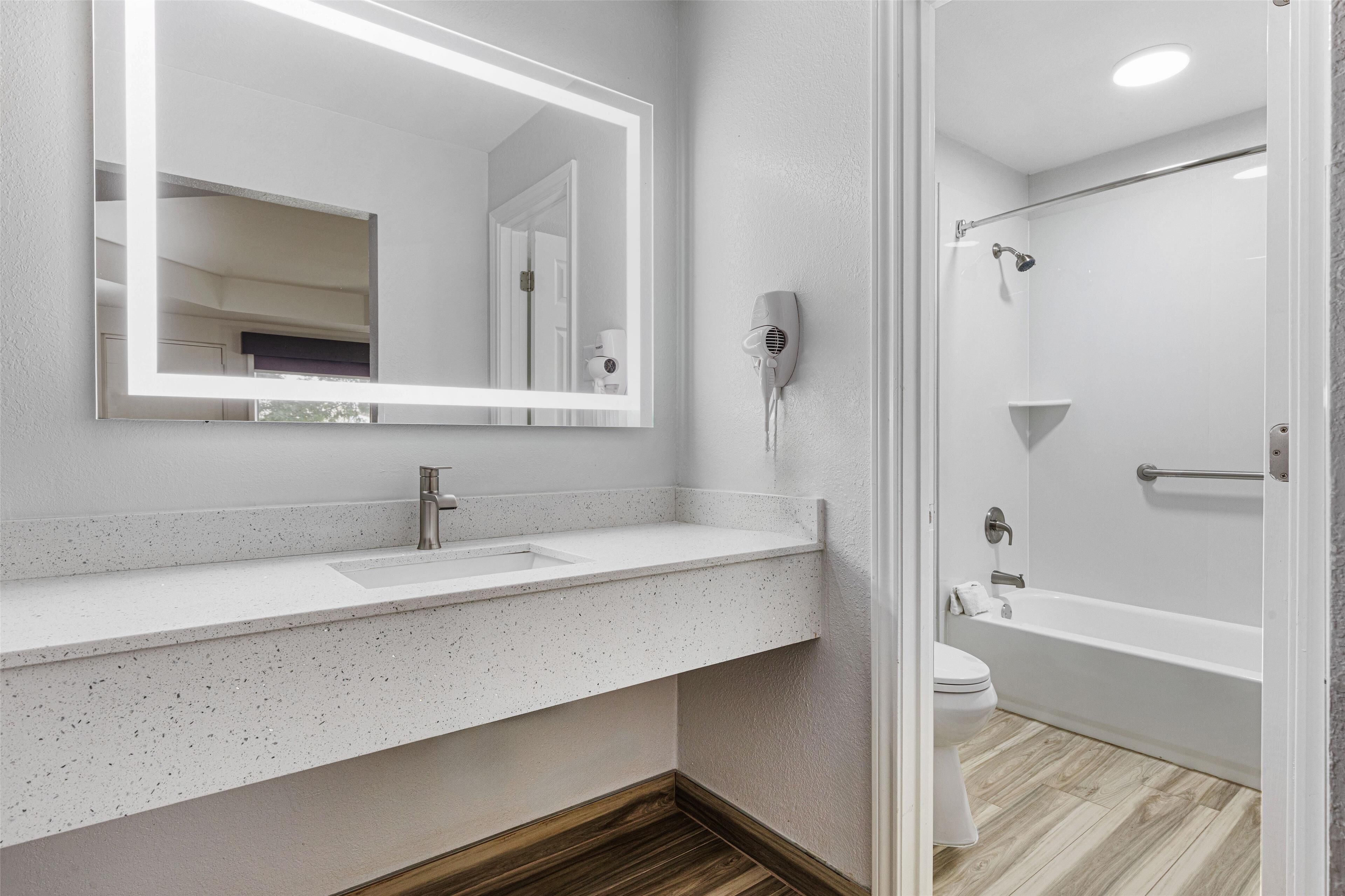 standard room, 1 king bed, non smoking, refrigerator & microwave | bathroom | shower, free toiletries, hair dryer, towels