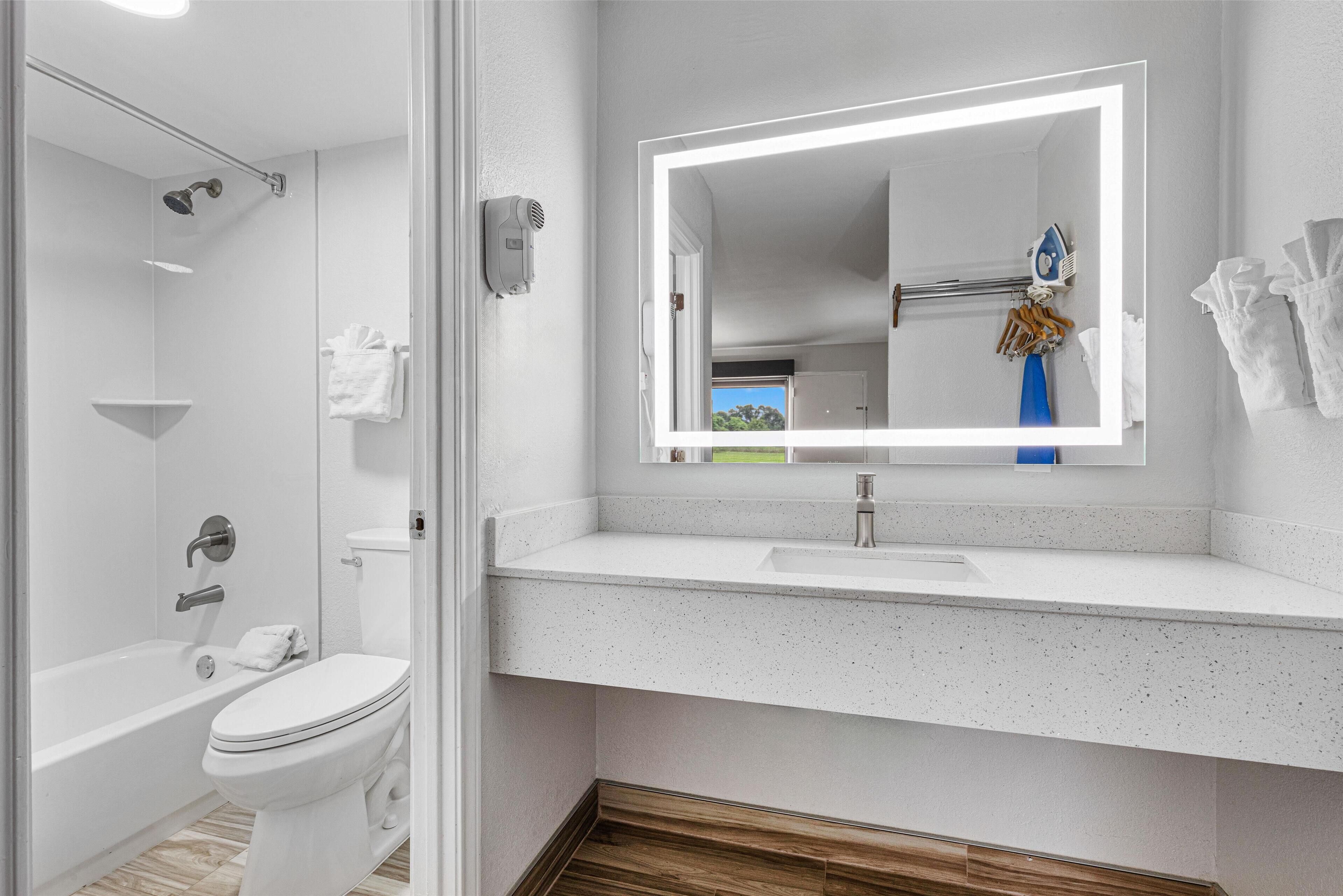 standard room, 1 king bed, non smoking, refrigerator & microwave | bathroom | shower, free toiletries, hair dryer, towels