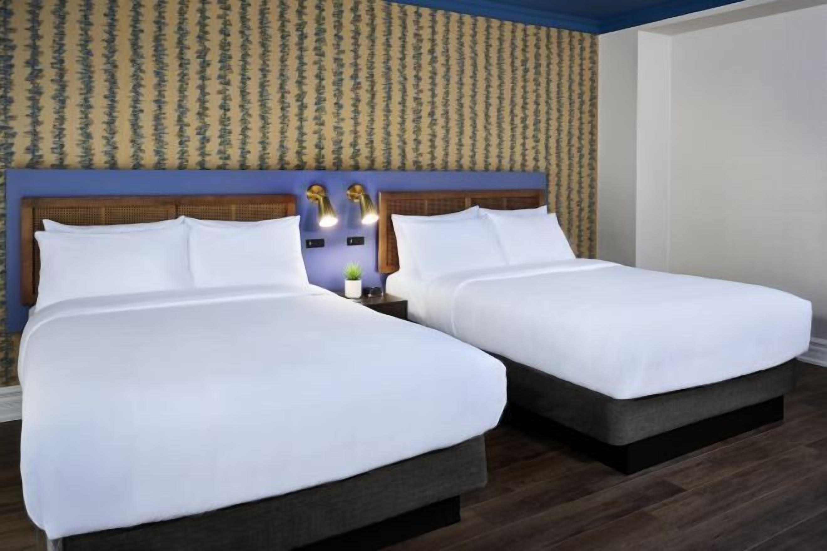 Pillow-top beds, desk, blackout curtains, iron/ironing board